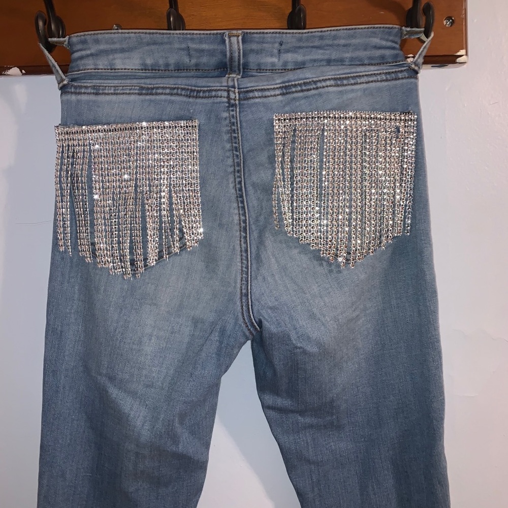 Size 25 jeans. With crystal accents